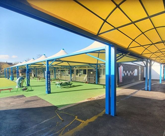 Covered walkway canopy links primary school classrooms
