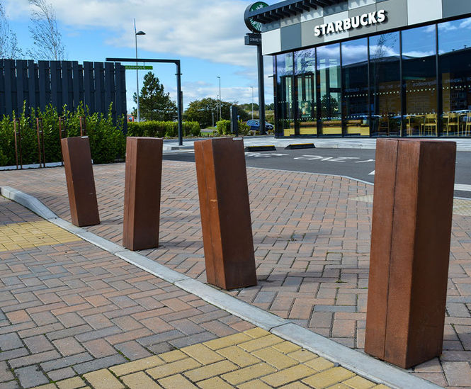 Corten steel bollards and cycle stands for retail park