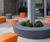 Orange and grey outdoor seating to match GSK branding 0