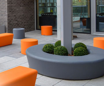 Orange and grey outdoor seating to match GSK branding