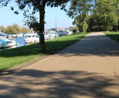 Decorative coloured surfacing for riverside pathway