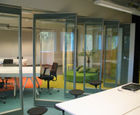 Glass sliding folding partitions