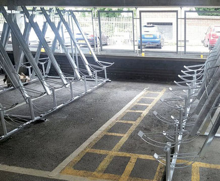 Semi-vertical space-saving cycle racks