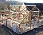 Bespoke roundwood T-shaped barn for weddings and events