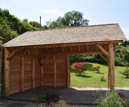 Bespoke shingled timber shelter for farmhouse garden