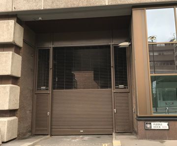 Hybrid grille / shutter for loading bay at Puddle Dock