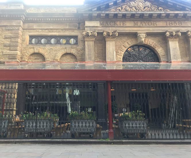 Collapsible gates secure Mackie Mayor, Manchester