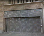 Bespoke folding doors with vehicle motif secure Dutch mall