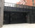 Electrically-operated multi-fold gates for service bay 4