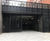 Electrically-operated multi-fold gates for service bay 0