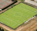 Sand-dressed hockey pitches