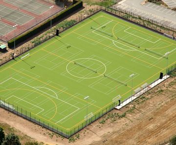 Sand-dressed hockey pitches