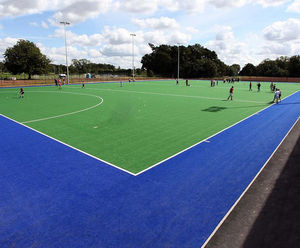 Artificial sports surface construction