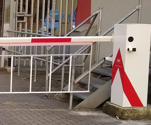 Automatic barriers with LED strip traffic lights on boom