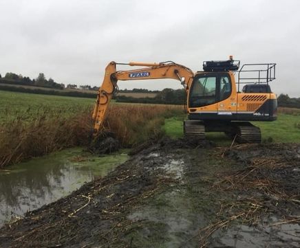 Clearing a watercourse at Shotley Gate Marshes