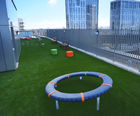 Artificial grass play surfacing
