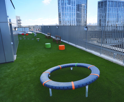 Artificial grass play surfacing