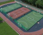 Polymeric sports surfacing for MUGAs, pitches and tracks