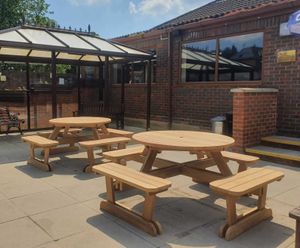 Round iroko 8-seater picnic table and benches