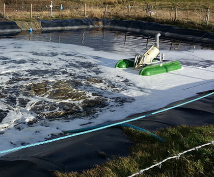 Self-aspirating spiral aerator for wastewater treatment