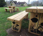 Engraved timber picnic tables, seats and bins for park