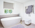 Newick 1000 flat front stainless steel heated towel rail