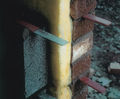 Expansion joint ties with debonding sleeves