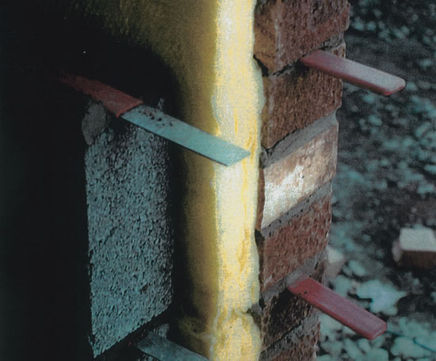Expansion joint ties with debonding sleeves