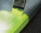 Fluorescent, solvent-free high visibility paint