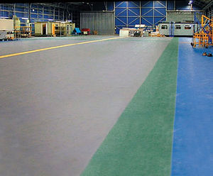 Interlocking plastic floor tiles